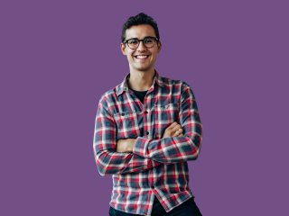 Man in front of purple background