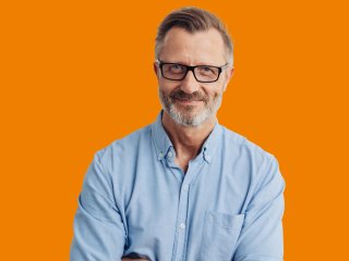 Man with glasses and blue shirt